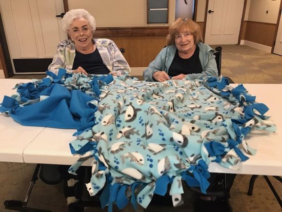 Senior residents, Mary McAlpine and Audrey Betz of Saint Therese of Woodbury, making a blanket to be given to kids - patients at Gillette Children’s Hospital. 